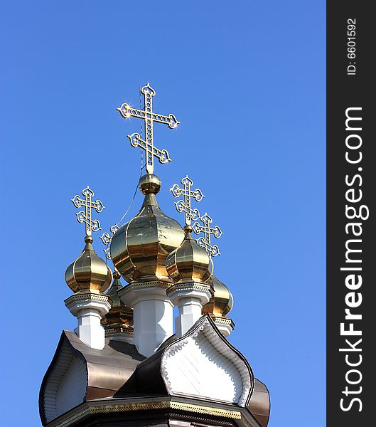 Domes of orthodox church on a blue sky background. Russia