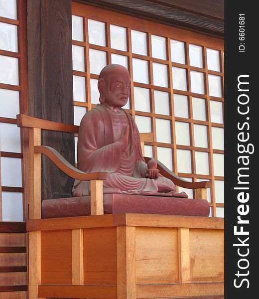 A monk statue at a tiny temple called Nekodera (cat temple) in Kyoto, Japan.  People have services and bury their pets at this temple.