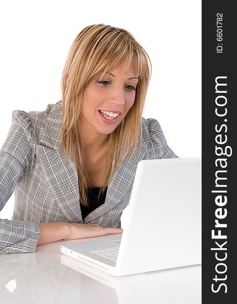 Portrait of confident business woman sitting at the table and typing a document on the laptop. Portrait of confident business woman sitting at the table and typing a document on the laptop