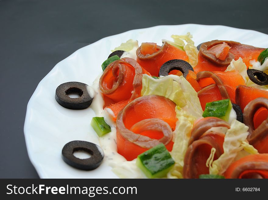 Salmon salad on white plate