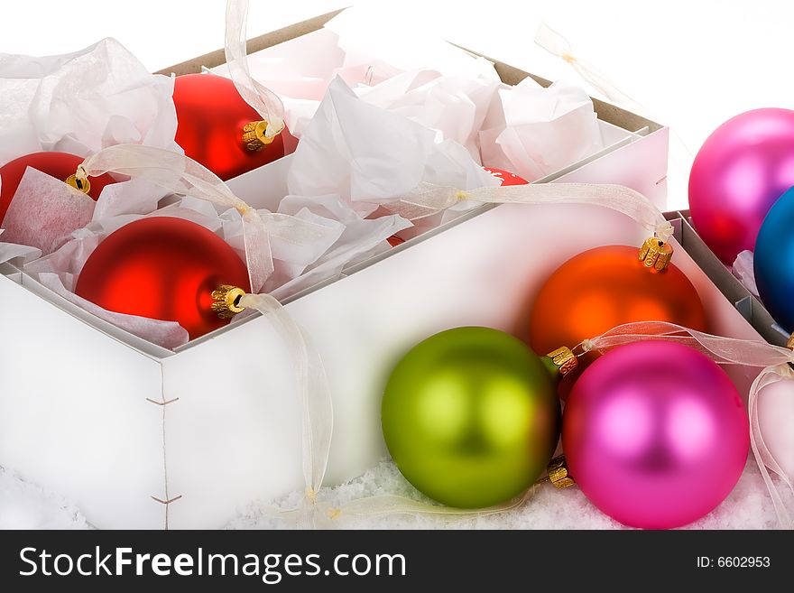 Boxed Christmas bauble decorations, being put away or being brought out foe use.