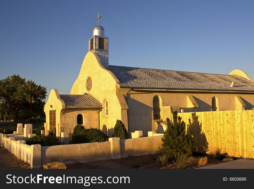 Very old rural New Mexico Catholic church at sunset.  In San Ysidro, New Mexico. Very old rural New Mexico Catholic church at sunset.  In San Ysidro, New Mexico.