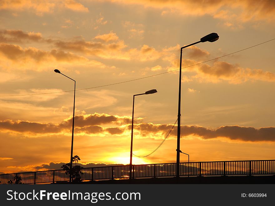Silhouettes of bridge and electricity poles at the dusk. Silhouettes of bridge and electricity poles at the dusk