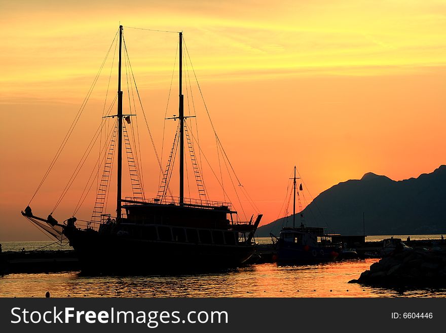 Ship silhouette after sunset  and red sky