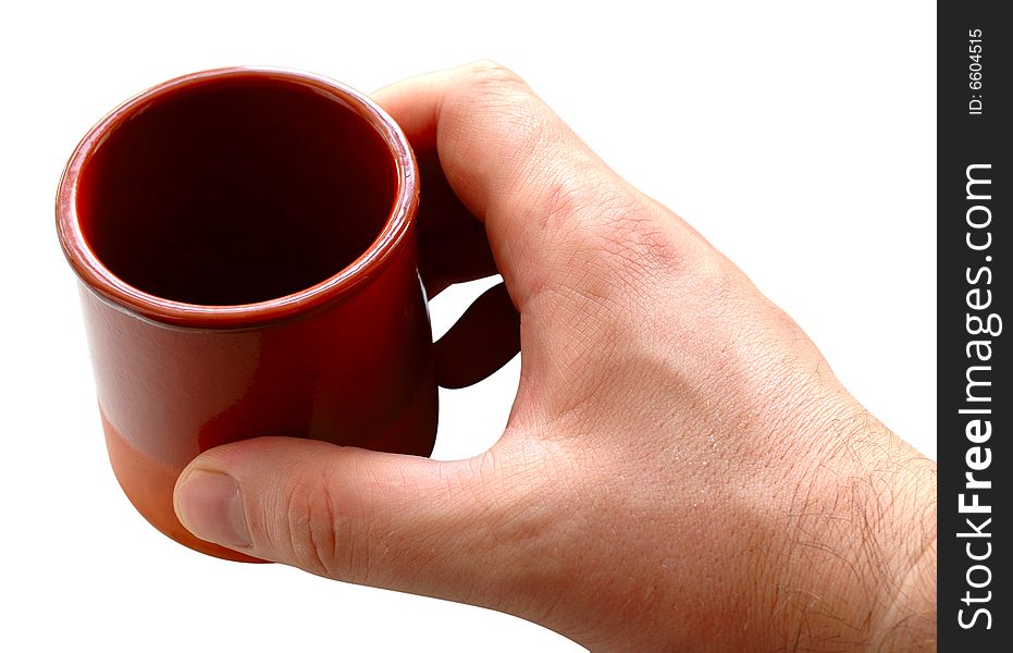 Pottery cup for tea or coffee in man's hand on isolated background. Pottery cup for tea or coffee in man's hand on isolated background.