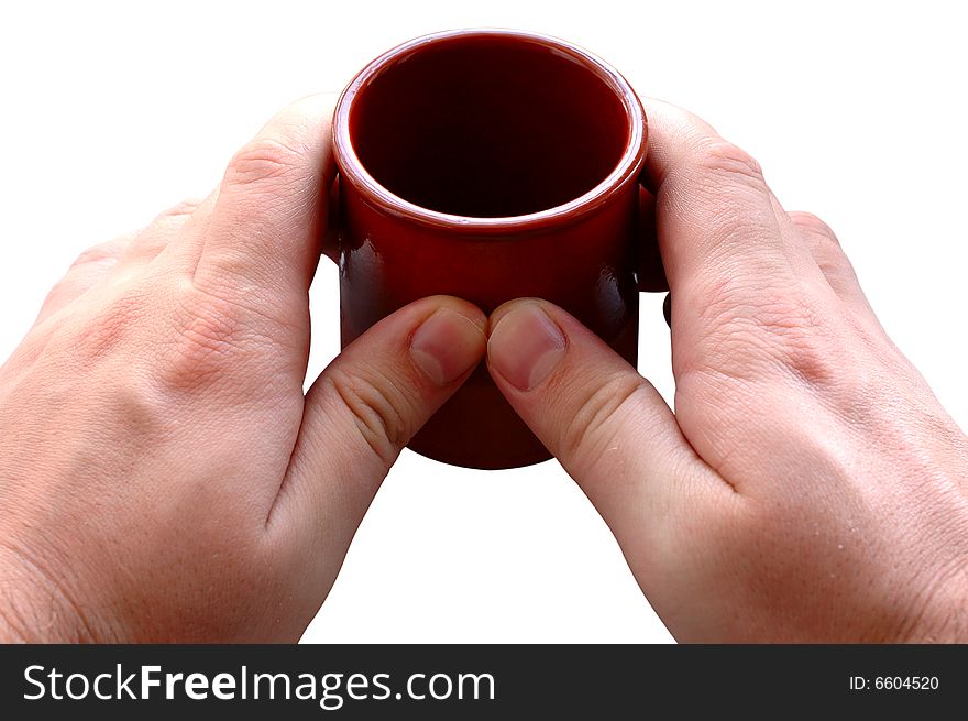 Pottery cup for tea or coffee in man's hands on isolated background. Pottery cup for tea or coffee in man's hands on isolated background.