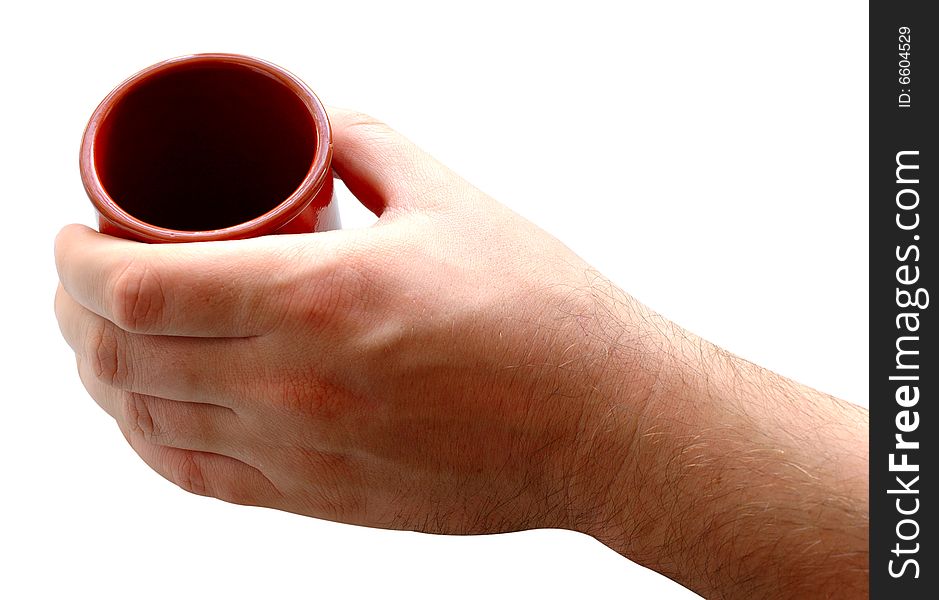 Pottery cup for tea or coffee in man's hand on isolated background. Pottery cup for tea or coffee in man's hand on isolated background.