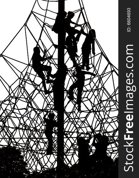 Silhouette of kids playing at the playground net. Silhouette of kids playing at the playground net