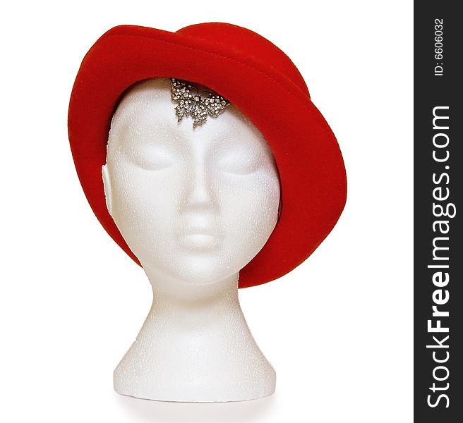 Female mannequin wearing a red hat with butterfly diamond jewellery. Clipping path included, great as design element. Female mannequin wearing a red hat with butterfly diamond jewellery. Clipping path included, great as design element