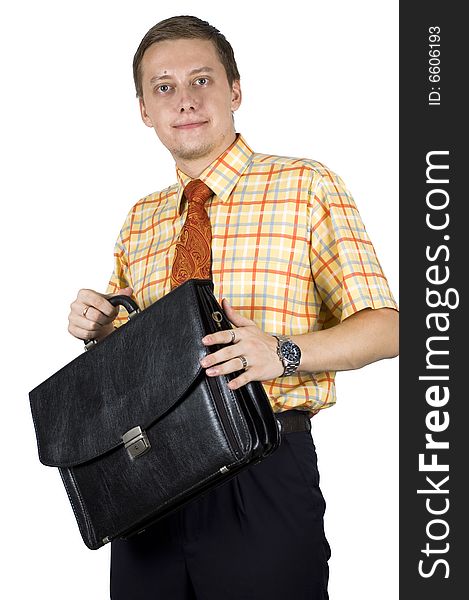 Young, elegant European businessman, wearing suit, shirt and tie. Smiling friendly. Taking brief case for work. Young, elegant European businessman, wearing suit, shirt and tie. Smiling friendly. Taking brief case for work