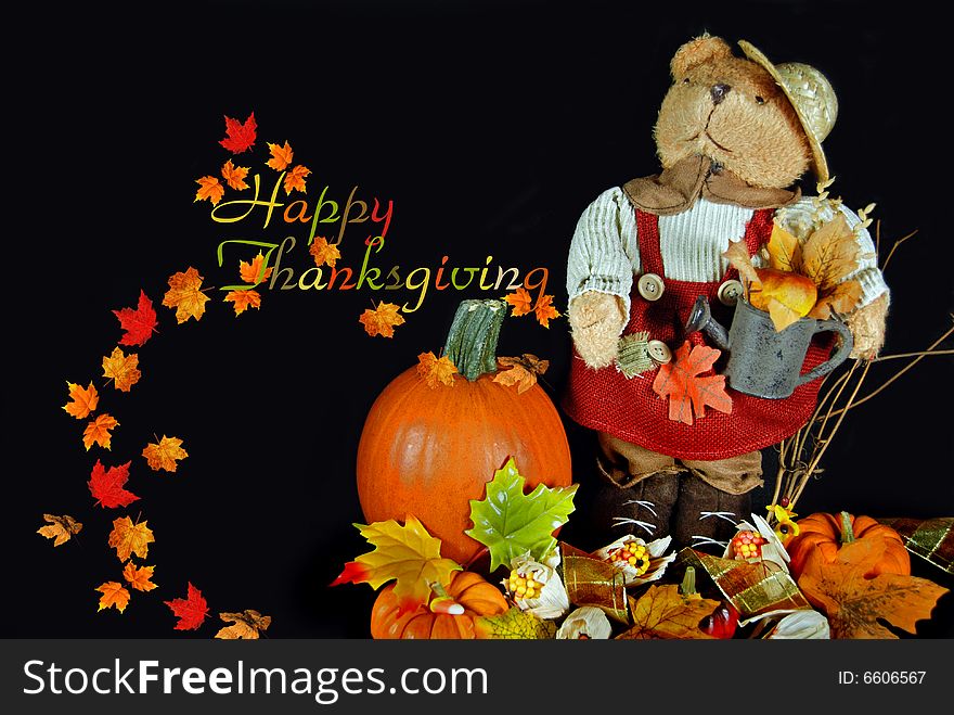 Teddy bear in a thanksgiving holiday display. Teddy bear in a thanksgiving holiday display.