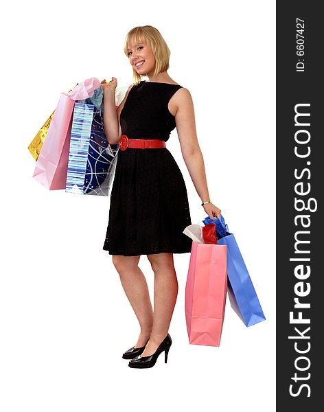 Cute happy blond girl in black dress with colorful shopping bags. Cute happy blond girl in black dress with colorful shopping bags