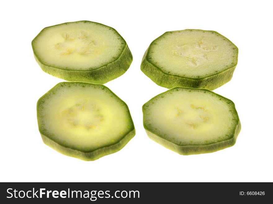 Slices of vegetable marrow isolated on white