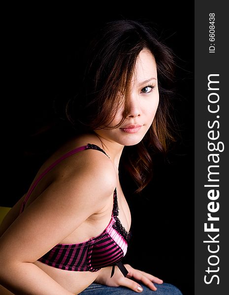 Glamourous asian woman in funky bra top. Glamourous asian woman in funky bra top