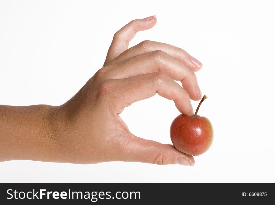 Red apple in hand isolated on white backgrounds