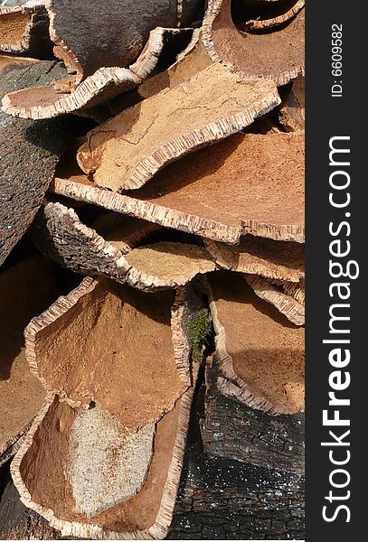 Stack of oak's bark used to produce corks for wine bottles. Stack of oak's bark used to produce corks for wine bottles