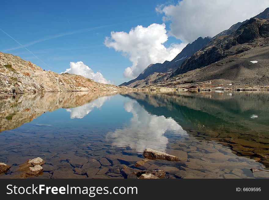 Mountain mirror on lake Lac de la Fare . Mountain mirror on lake Lac de la Fare