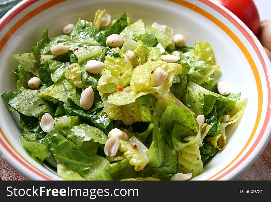 A fresh salad with some peanuts and spices