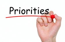 Hand Writing Priorities With Red Marker On Transparent Wipe Board. Royalty Free Stock Image Hand Writing Priorities With Red Marker On Transparent Wipe Board. Royalty Free Stock Image