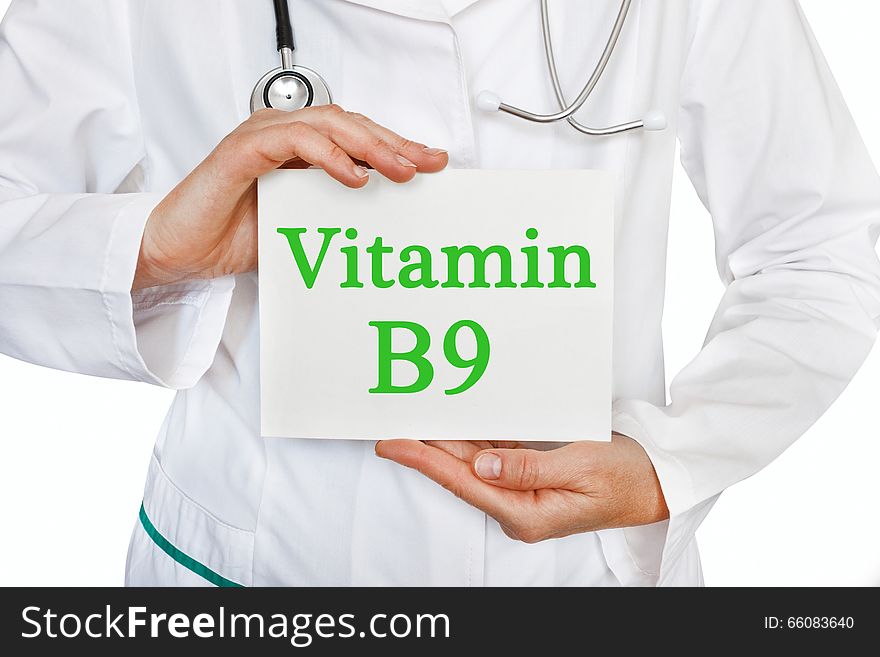 Vitamin B9 written on a card in doctors hands