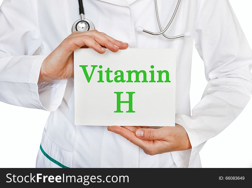 Vitamin H Written On A Card In Doctors Hands