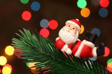 Santa Resting Over A Christmas Branch Tree Stock Photo