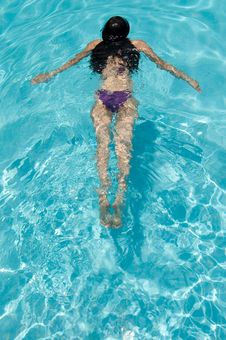 Girl Swimming On A Hot Summer Day Royalty Free Stock Image