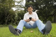 The Man Using Cell Phone Stock Photography