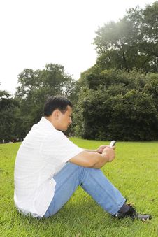 The Man Using Cell Phone Stock Photo