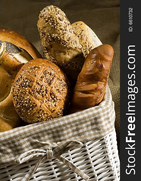 Bread and buns in a white basket