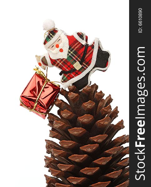 Santa with gift box over a pine cone