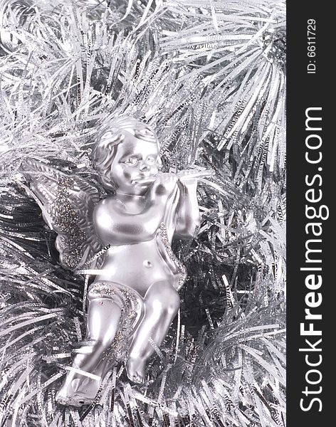 Close up of a little silver angel christmas ornament. Close up of a little silver angel christmas ornament.