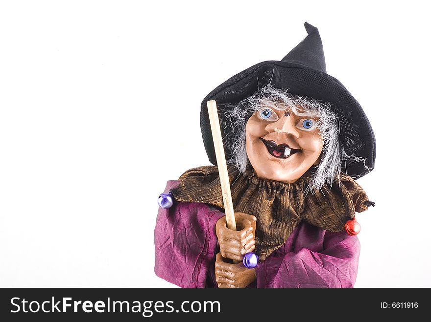 Portrait of a witch doll with copyspace; isolated on white. Portrait of a witch doll with copyspace; isolated on white.