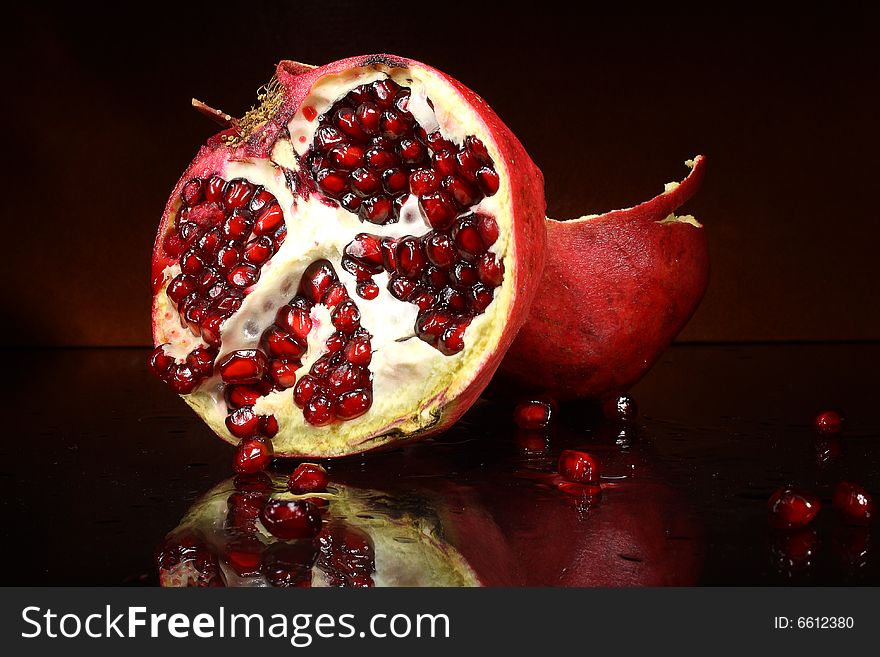 Photo red fruit grenades on a dark background. Photo red fruit grenades on a dark background