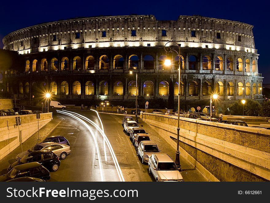 Photo of the colosseum in the dusk. Photo of the colosseum in the dusk.