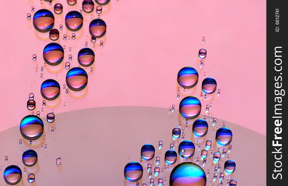 Colorful water drops on CD