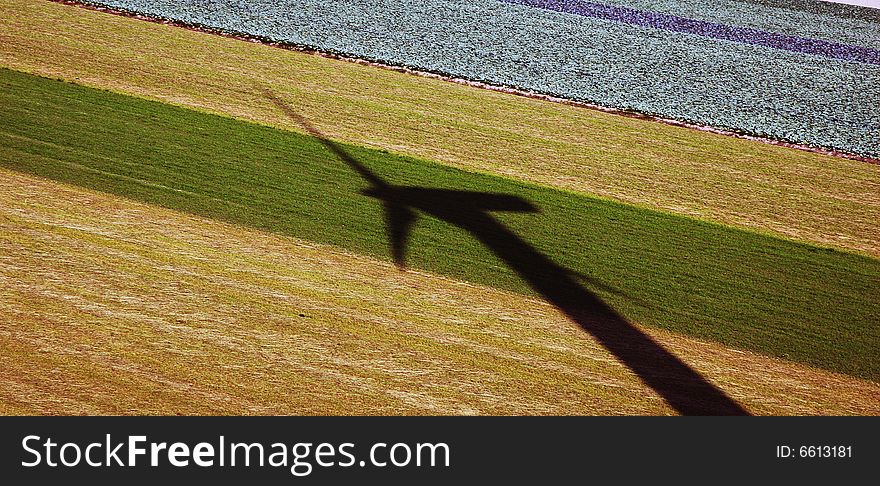 Wind turbin shadow on the field