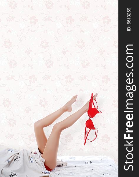 Picture of beautiful woman's legs with red bra. Picture of beautiful woman's legs with red bra