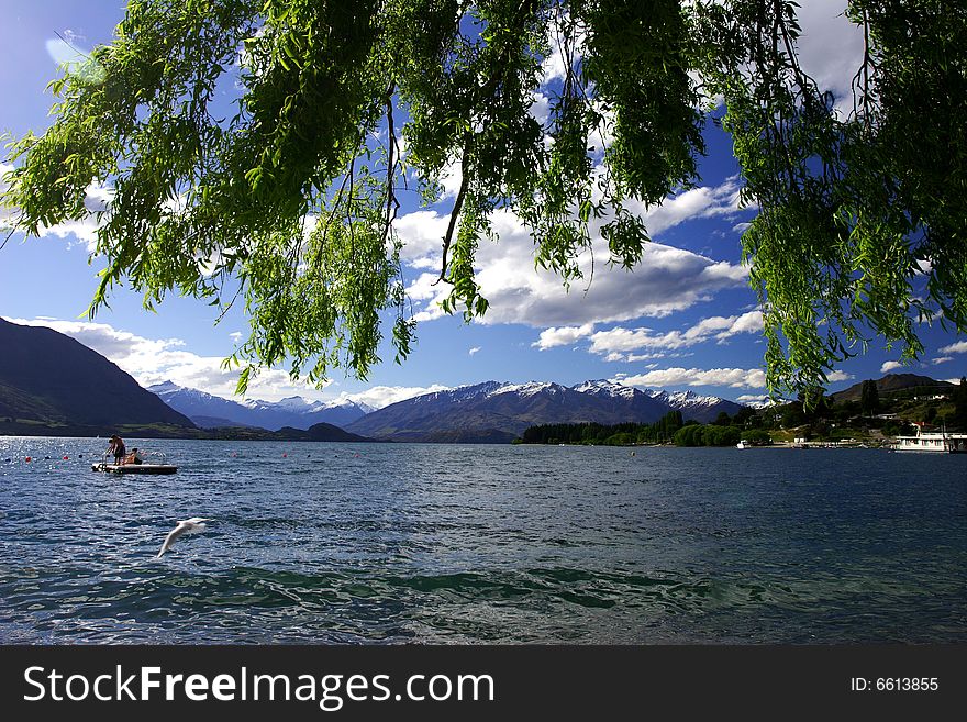 Watching sunset and snow mountain by lake wanaka, New Zealand,