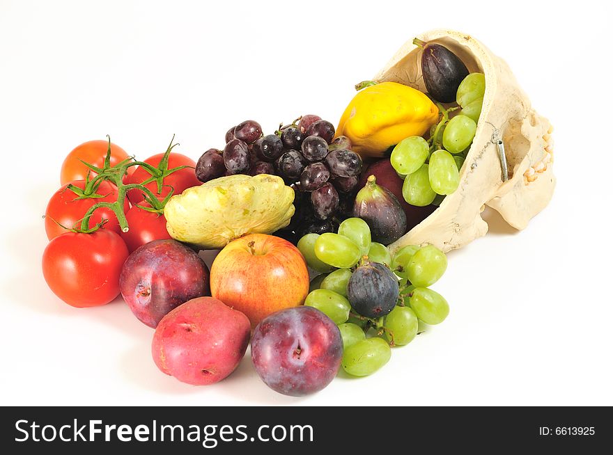 A human skull overflowing with fruits and vegetables, from behind. A human skull overflowing with fruits and vegetables, from behind.