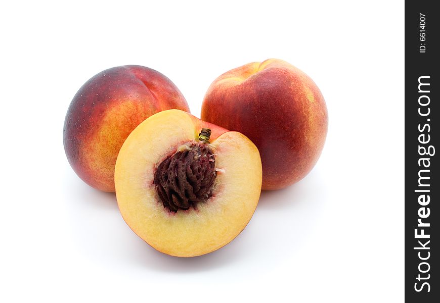 Three peaches  on white background.