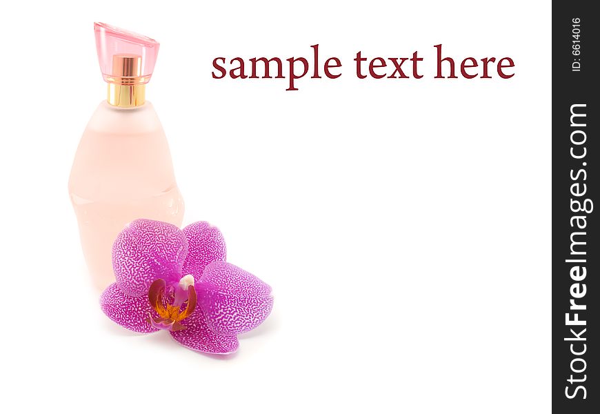 Bottle of perfume and orchid