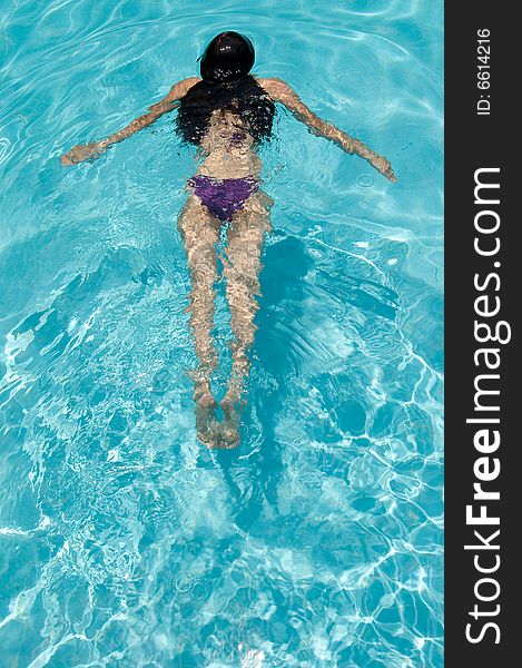 Photo of a girl swimming on a hot summer day