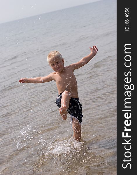 Boy playing in the water. Boy playing in the water