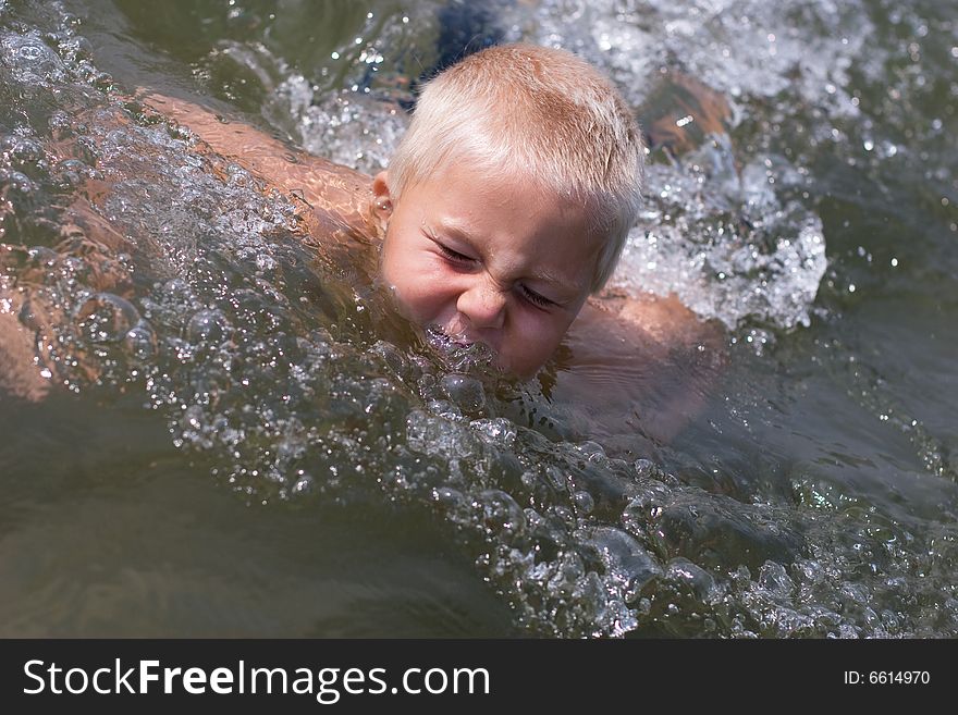 Boy playing in the water. Boy playing in the water