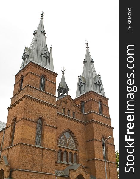 A red church against the white sky