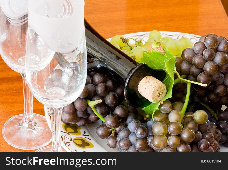 Bottle of wine, candle and glass