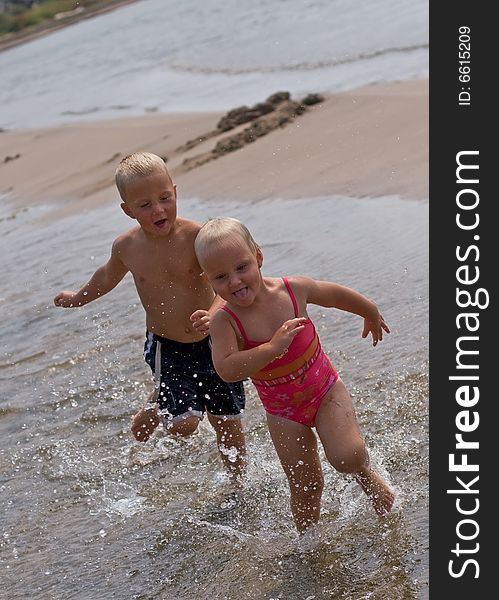 Kids Running At The Beach