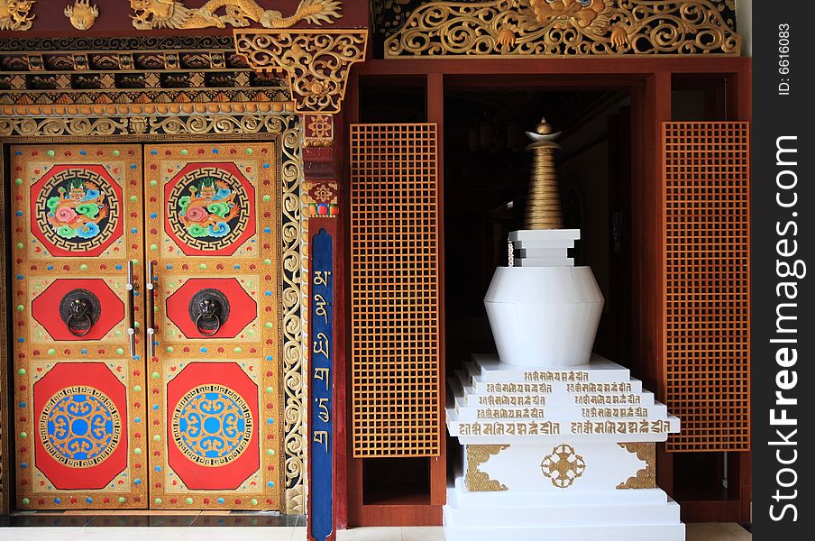 White stupa and ancient door in shangrala ,yunnan,china