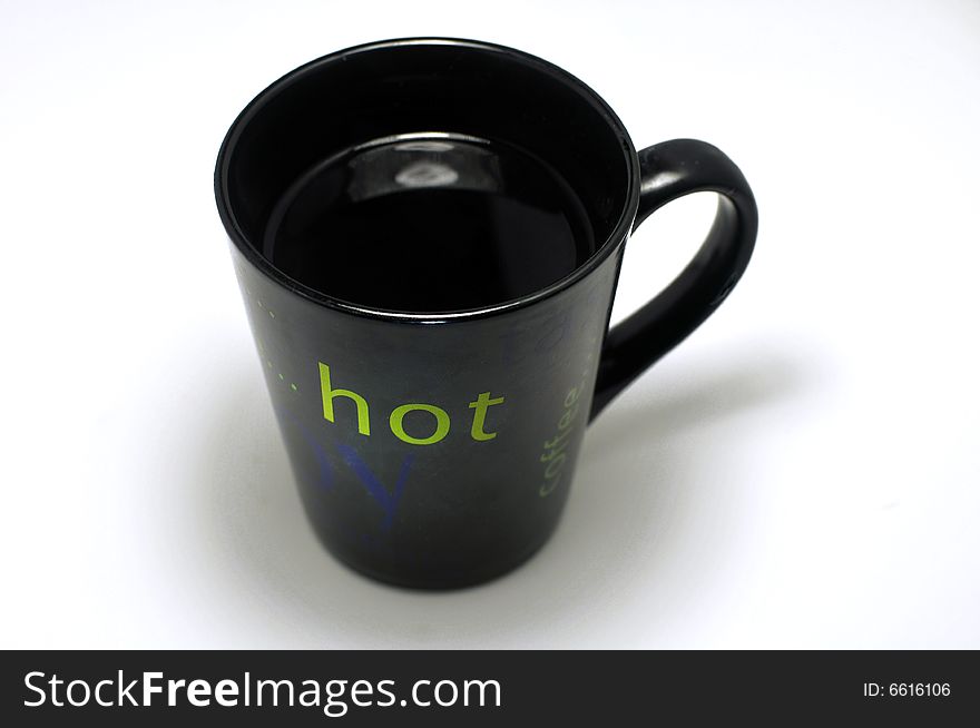 A black hot cup of cafe. A black hot cup of cafe